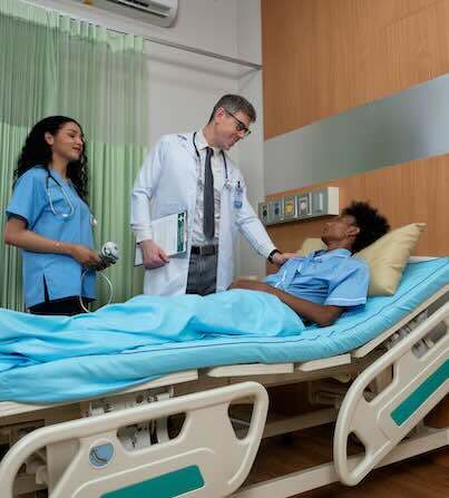 Medical staff in an acute care center attending to a patient