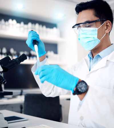 A technician processing specimens in a clinical testing laboratory