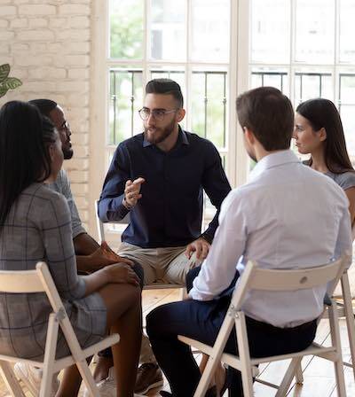 Counselor meeting a client at a community mental health clinic