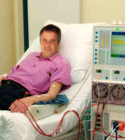 A patient receiving dialysis treatment at an outpatient center