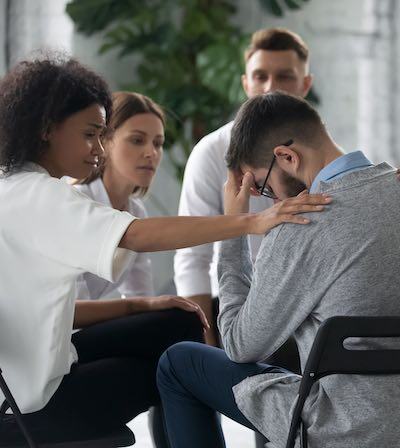 A counselor with a client in a drug and alcohol rehabilitation center