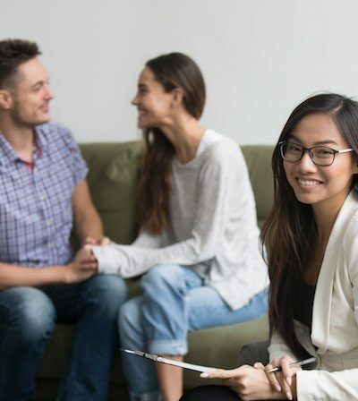 Counselor working with a family in a therapy session