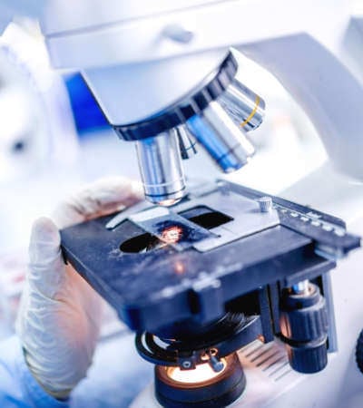 A medical laboratory technician processing samples
