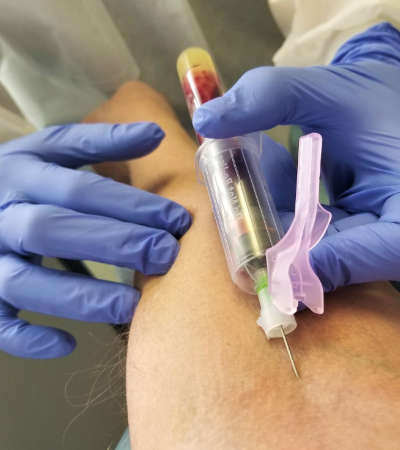 Phlebotomist reviewing malpractice insurance coverage