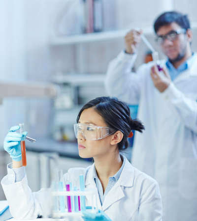 Technician processing samples at a medical diagnostics facility