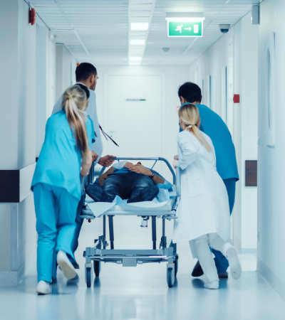 Clinical staff treating a walk-in patient at an urgent care medical center
